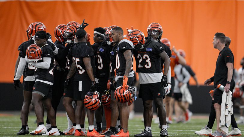 Cincinnati Bengals defensive players huddle during an NFL football practice, Tuesday, June 11, 2024, in Cincinnati. (AP Photo/Jeff Dean)