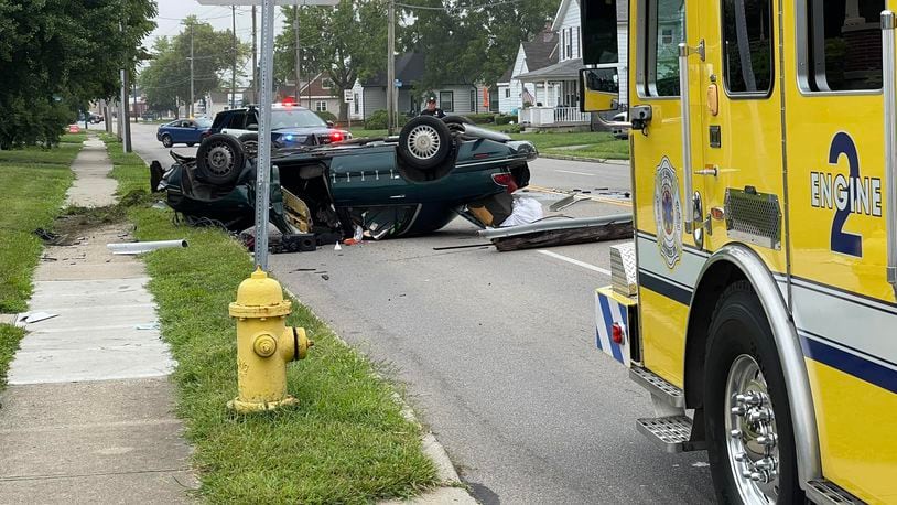 A utility pole was knocked down across the roadway during a rollover crash that caused one minor injury Friday morning, Aug. 2, 2024, on North Dixie Drive in Vandalia. CONTRIBUTED