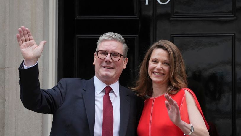 Britain's Labour Party Prime Minister Keir Starmer and his wife Victoria wave to the crowds of supporters and media from the doorstep of 10 Downing Street in London, Friday, July 5, 2024. Labour leader Starmer won the general election on July 4, and was appointed Prime Minster by King Charles III at Buckingham Palace, after the party won a landslide victory. (AP Photo/Kin Cheung)