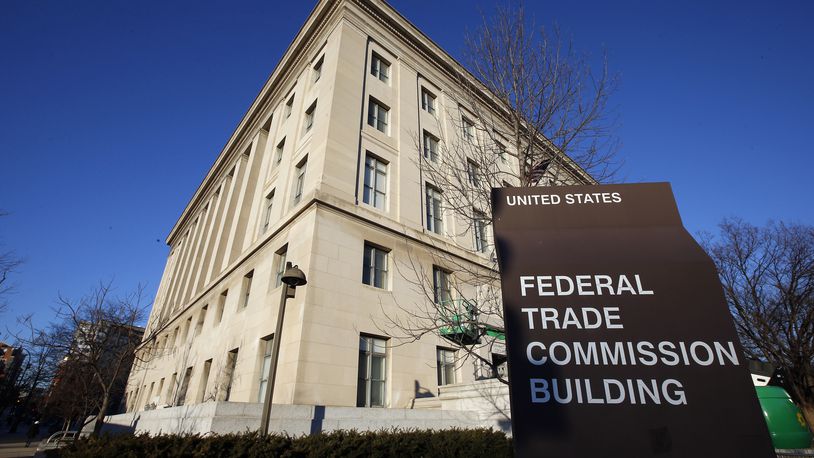 FILE - A sign stands outside the Federal Trade Commission building, Jan. 28, 2015, in Washington. (AP Photo/Alex Brandon, File)