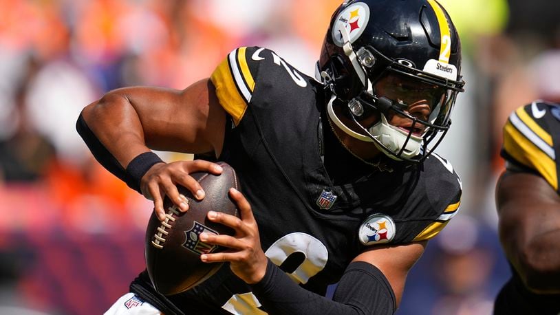 Pittsburgh Steelers quarterback Justin Fields (2) scrambles during the first half of an NFL football game against the Denver Broncos, Sunday, Sept. 15, 2024, in Denver. (AP Photo/Jack Dempsey)