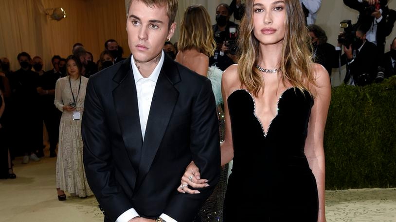 FILE - Justin Bieber, left, and Hailey Bieber attend The Metropolitan Museum of Art's Costume Institute benefit gala on Sept. 13, 2021, in New York. (Photo by Evan Agostini/Invision/AP, File)