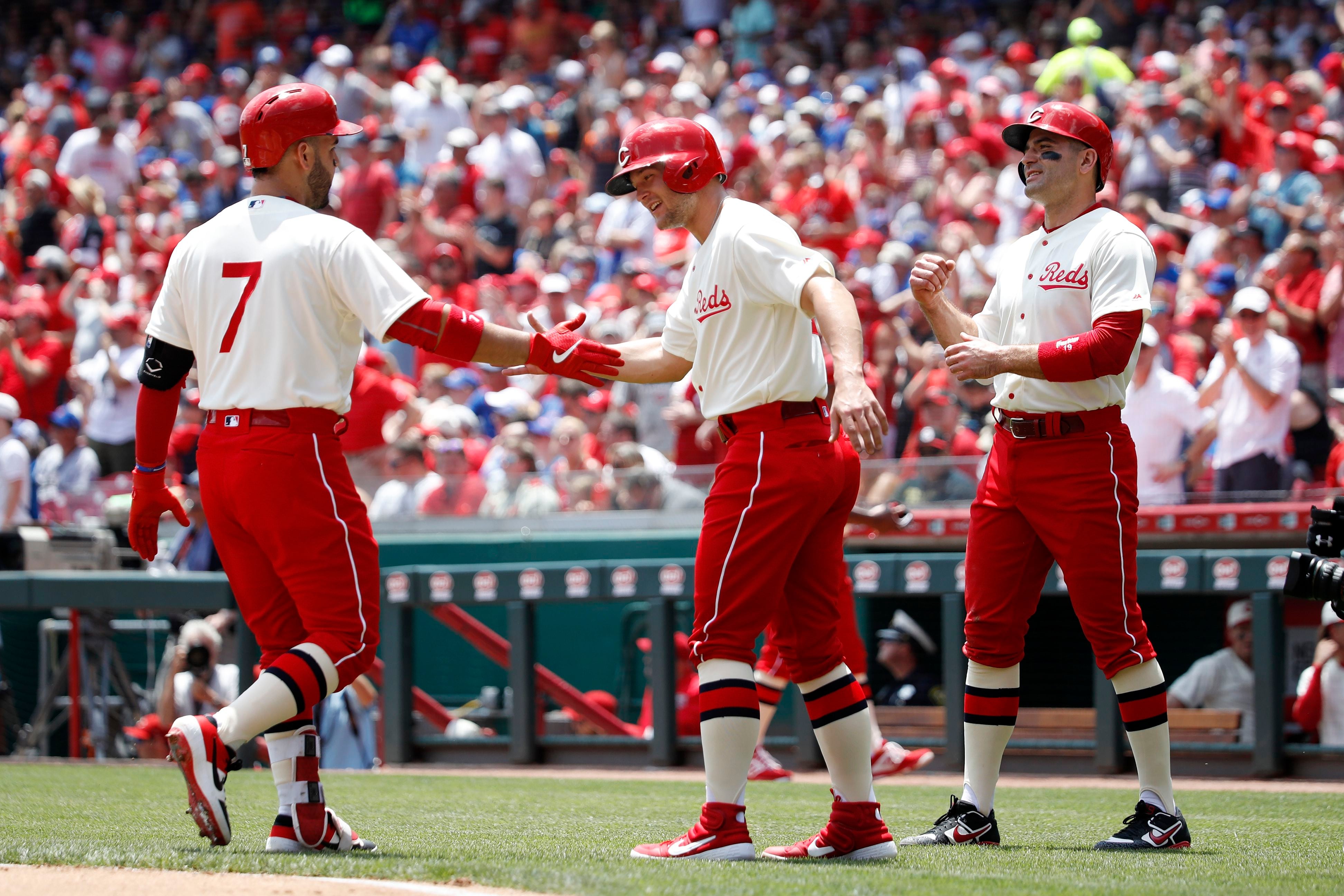 Reds play in sleeveless throwback uniforms against St. Louis Cardinals