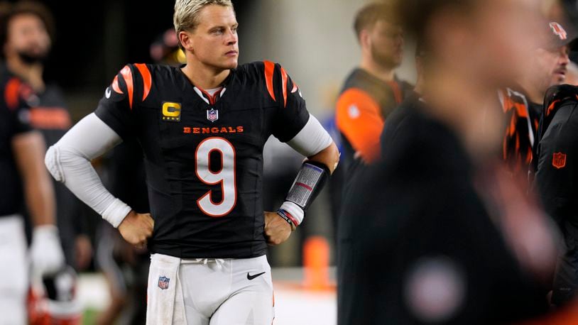 Cincinnati Bengals quarterback Joe Burrow (9) watches from the sideline during the second half of an NFL football game against the Washington Commanders, Monday, Sept. 23, 2024, in Cincinnati. (AP Photo/Jeff Dean)