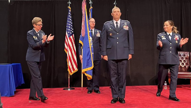 Col. Kenneth A. Stremmel, center front, took command of the National Air and Space intelligence Center at the National Museum of the U.S. Air Force Friday July 26. To Stremmel's right is Lt. Gen. Leah Lauderback, a former NASIC commander and deputy chief of staff for intelligence for the Air Force. To his left is Brig. Gen.-select Ariel Batungbacal, the former NASIC commander. THOMAS GNAU/STAFF