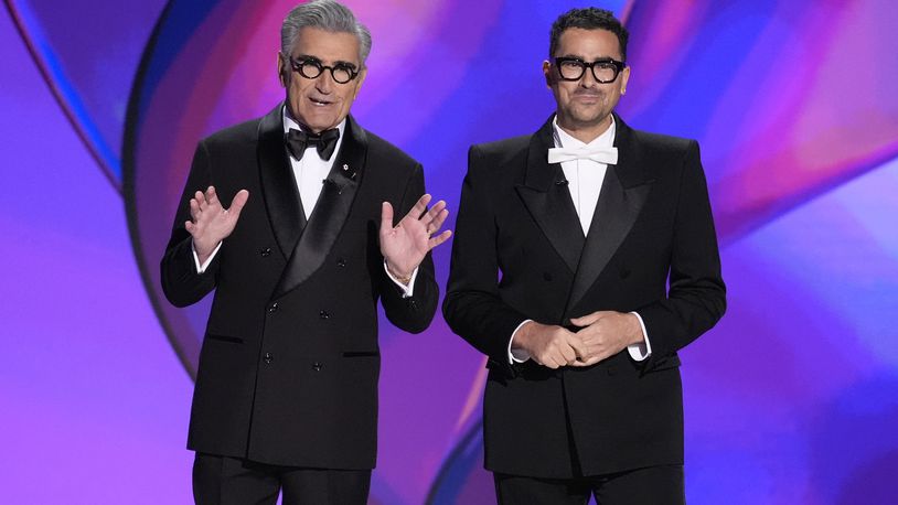 Hosts Eugene Levy, left, and Dan Levy speak during the 76th Primetime Emmy Awards on Sunday, Sept. 15, 2024, at the Peacock Theater in Los Angeles. (AP Photo/Chris Pizzello)