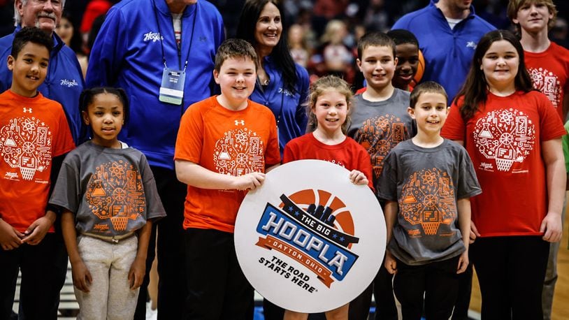 Participants in the 2023 Big Hoopla Stem Challenge line up for a photograph during halftime at the NCAA First Four at University of Dayton Arena Tuesday, March 14, 2023. The tournament marks the official start of March Madness, JIM NOELKER/STAFF