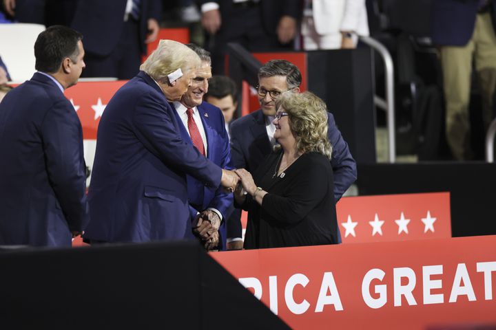 
                        Former President Donald Trump, the Republican presidential nominee, greets Beverly, the mother of Sen. JD Vance (R-Ohio), the Republican vice presidential nominee,  on the third night of the Republican National Convention at the Fiserv Forum in Milwaukee, on Wednesday, July 17, 2024. From left: Trump, Gov. Doug Burgum of North Dakota, House Speaker Mike Johnson (R-La.) and Beverly Vance. (Maddie McGarvey/The New York Times)
                      