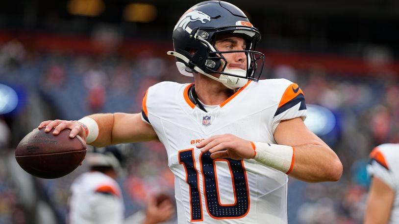 Denver Broncos quarterback Bo Nix warms up before a preseason NFL football game against the Green Bay Packers, Sunday, Aug. 18, 2024, in Denver. (AP Photo/Jack Dempsey)