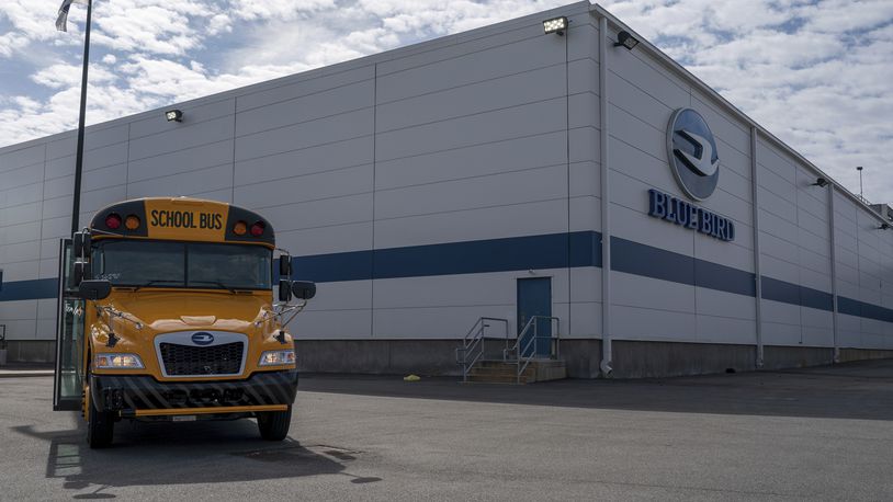 FILE -- An all-electric school bus sits on display in front of the Blue Bird Corp. factory in Fort Valley, Ga., on Feb. 8, 2023. The company and the United Steelworkers union said on Thursday, May, 23, 2024 that workers had approved an initial three-year contract after voting to unionize in May 2023. (Matthew Pearson/WABE via AP, file)