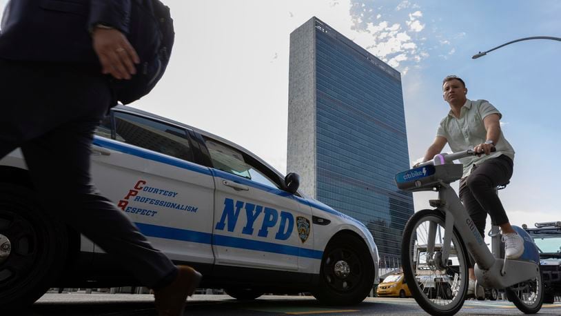 A NYPD patrol car parks across the street from the United Nations Headquarters, Saturday Sept. 21, 2024. (AP Photo/Stefan Jeremiah)