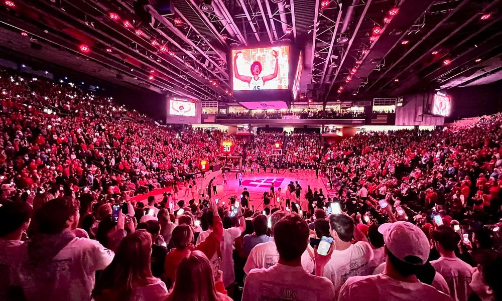 Dayton and Duquesne stand for the national anthem before a game on Tuesday, Feb. 13, 2024, at UD Arena. David Jablonski/Staff