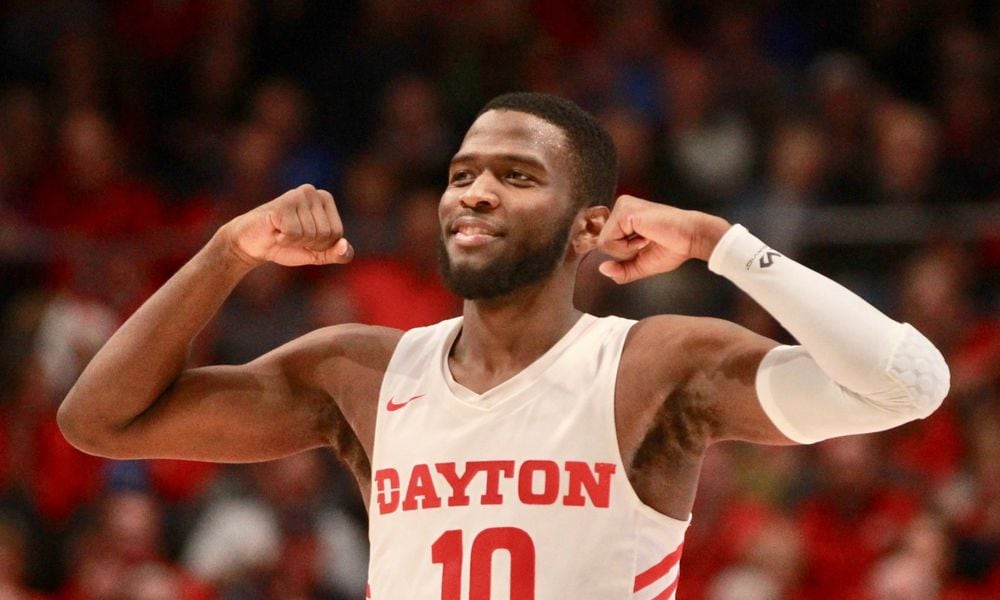 Daytons Jalen Crutcher flexes after a basket against Omaha on Tuesday, Nov. 19, 2019, at UD Arena. David Jablonski/Staff