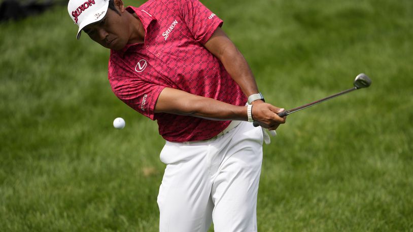 Hideki Matsuyama, of Japan, chips onto the 17th green during the first round of the BMW Championship golf event at Castle Pines Golf Club, Thursday, Aug. 22, 2024, in Castle Rock, Colo. (AP Photo/Matt York)