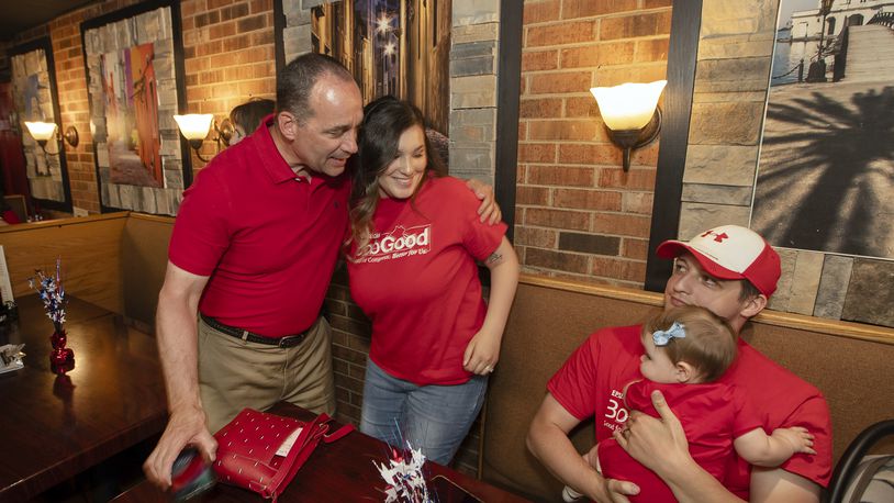 Rep. Bob Good, left, a candidate in the Republican primary for the state's 5th Congressional District, greets family members at a watch party in Lynchburg, Va., Tuesday, June 18, 2024. (AP Photo/P. Kevin Morley)