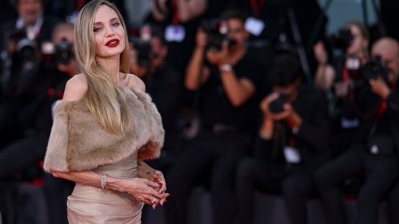 Angelina Jolie poses for photographers upon arrival for the premiere of the film 'Maria' during the 81st edition of the Venice Film Festival in Venice, Italy, on Thursday, Aug. 29, 2024. (Photo by Vianney Le Caer/Invision/AP)