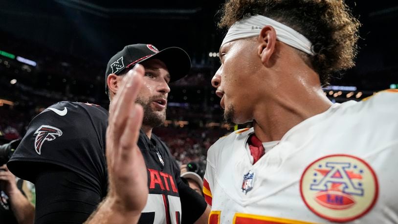 Atlanta Falcons quarterback Kirk Cousins speaks with Kansas City Chiefs quarterback Patrick Mahomes after an NFL football game, Sunday, Sept. 22, 2024, in Atlanta. The Kansas City Chiefs 22-17. (AP Photo/Brynn Anderson)