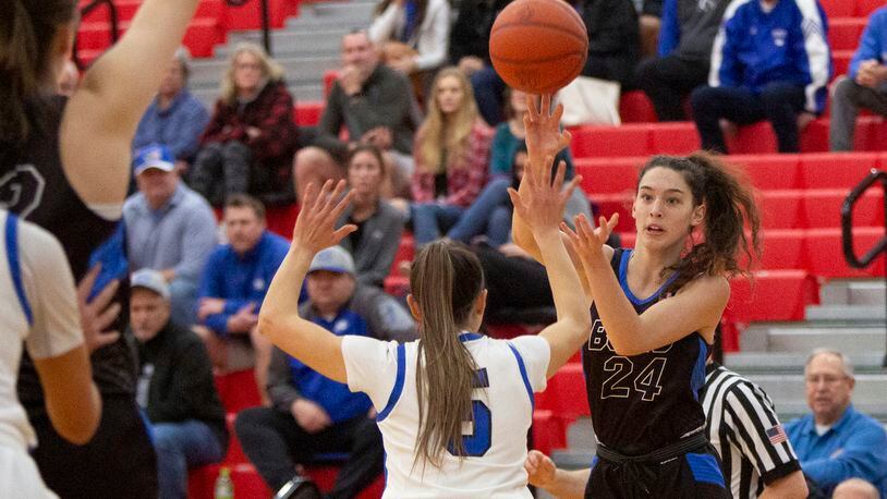 Springboro's Chloe Downing passes over Miamisburg's Dara Russo during a district semifinal game. Springboro, Centerville and Bellbrook lost in Division I district finals on Saturday. FILE PHOTO