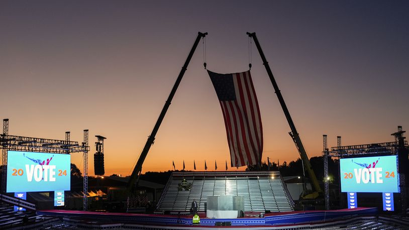 The campaign rally site is seen near sunrise before Republican presidential nominee former President Donald Trump speaks at the Butler Farm Show, Saturday, Oct. 5, 2024, in Butler, Pa. (AP Photo/Julia Demaree Nikhinson)