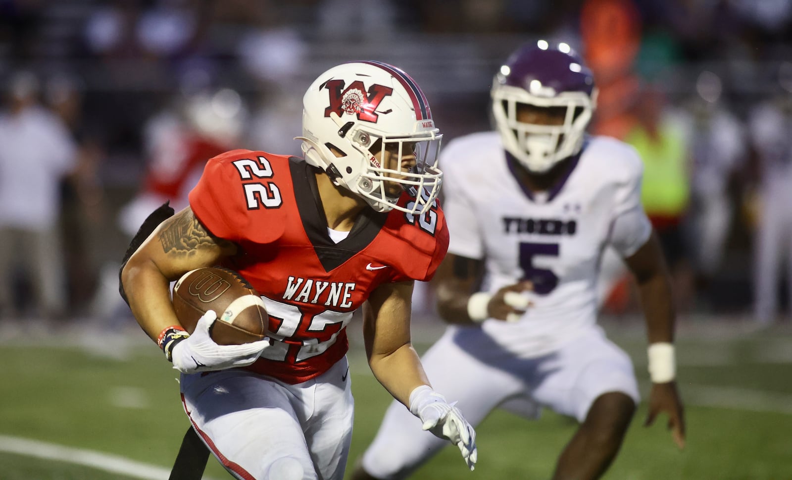 Wayne's Isaiah Thompson runs against Pickerington Central on Friday, Aug. 30, 2024, at Heidkamp Stadium in Huber Heights. David Jablonski/Staff