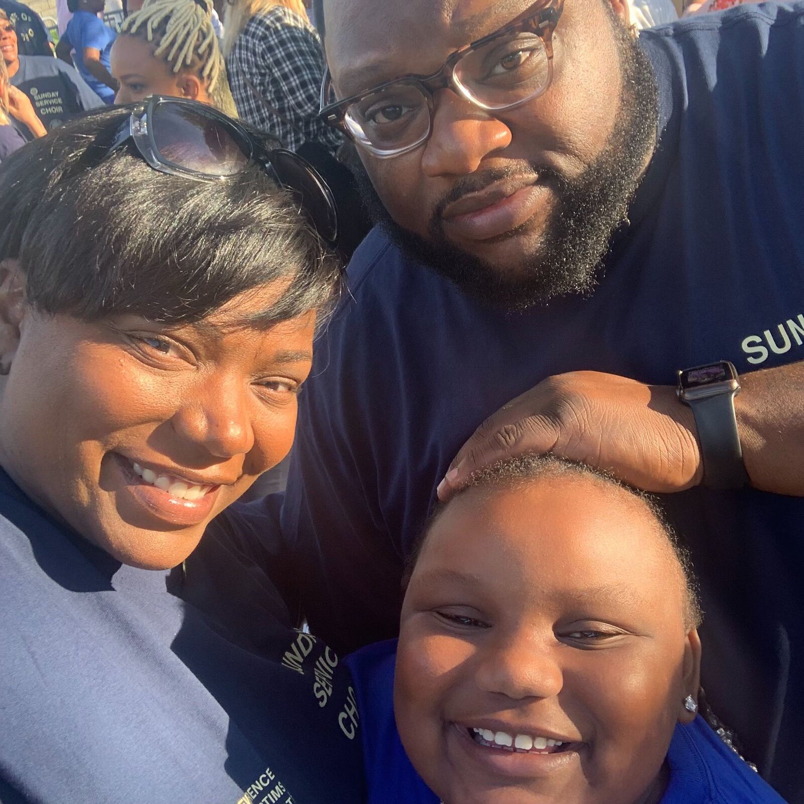 Ryleigh Manuel of Trotwood landed a space next to Kanye West during his Sunday Service on Aug. 25, 2019 at RiverScape MetroPark for Dayton mass shooting. She is pictured her with her mom and dad, Kelly Watts and Trae Manuel. (Photo Kelly Watts)