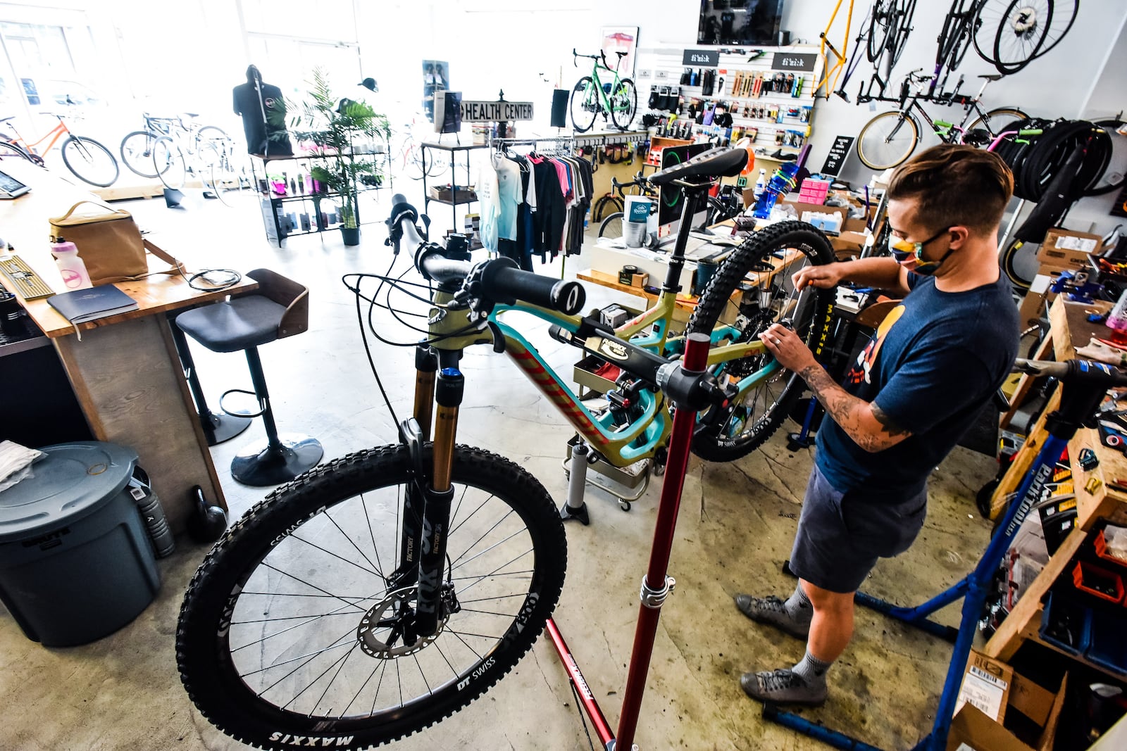 Otto Bohn, owner of Spoken Bicycles on Central Avenue in Middletown, offers a full range of bikes, repair services and parts along with beers on tap at the bike shop. NICK GRAHAM / STAFF