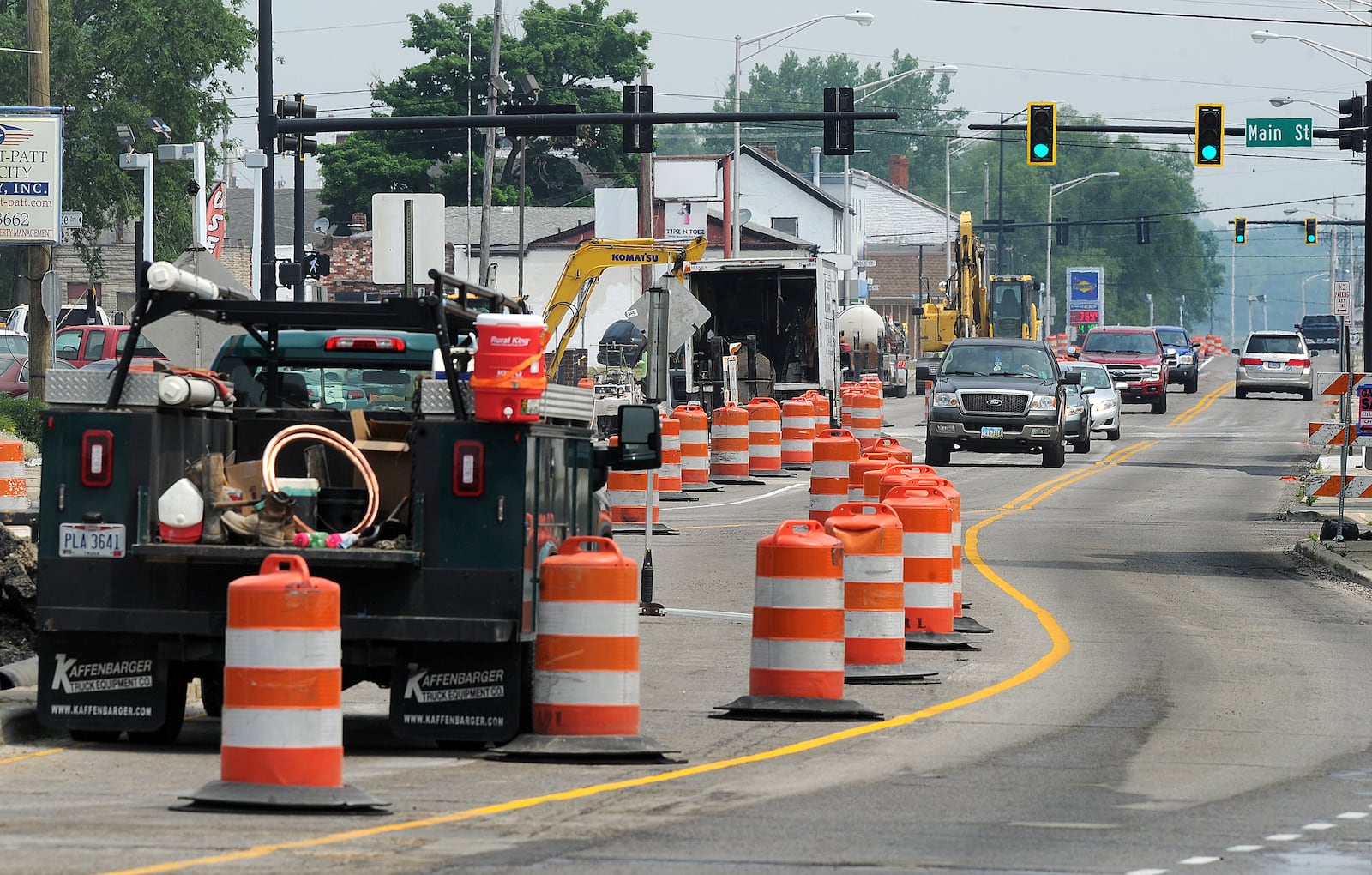 Drivers maneuver through orange traffic barrels Tuesday, June 6, 2023 in Fairborn as construction has started on Ohio 444 near Wright-Patterson Air Force Base. MARSHALL GORBY\STAFF