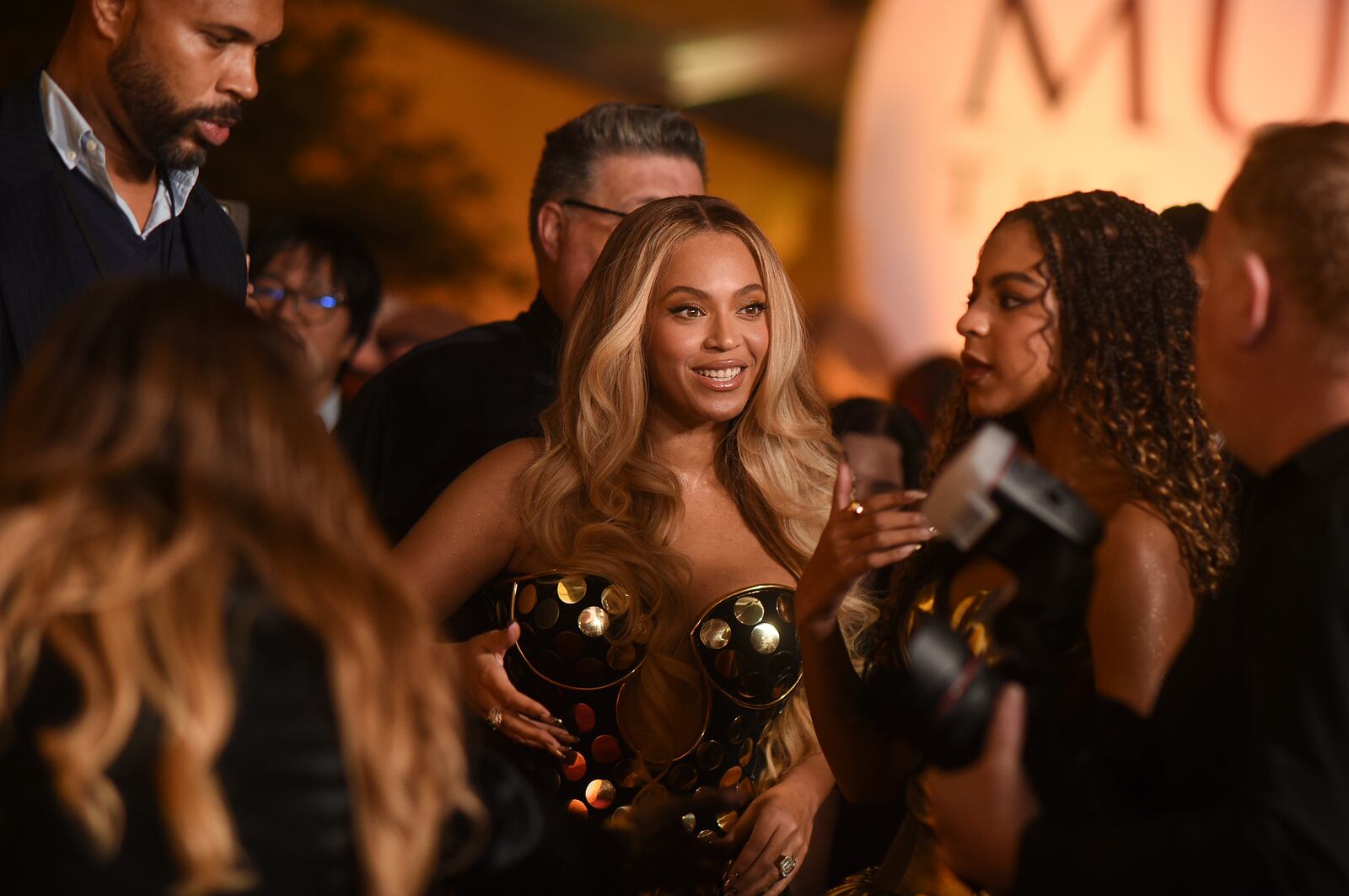 Beyoncé, center, arrives at the premiere of "Mufasa: The Lion King" on Monday, Dec. 9, 2024, at the Dolby Theatre in Los Angeles. (Photo by Richard Shotwell/Invision/AP)