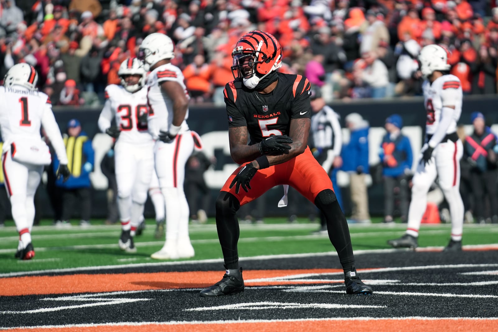 Cincinnati Bengals wide receiver Tee Higgins (5) celebrates after making a touchdown catch during the first half of an NFL football game against the Cleveland Browns, Sunday, Dec. 22, 2024, in Cincinnati. (AP Photo/Joshua A. Bickel)