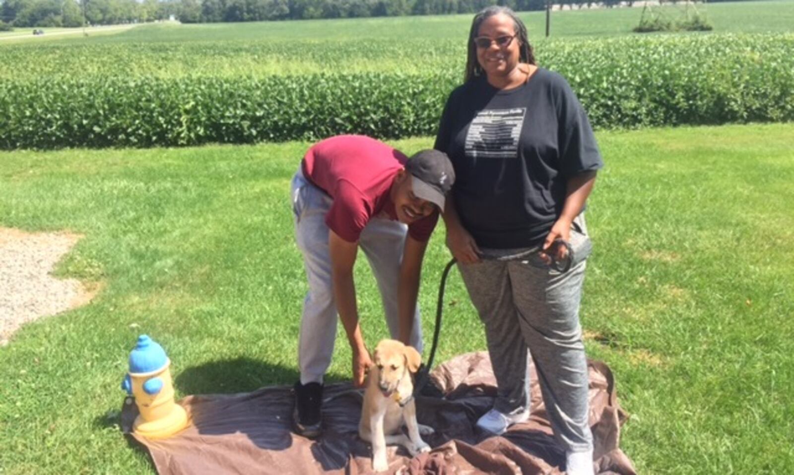 Darlene Pippin, right, traveled from Oak Park, Michigan, on Sunday, Sept. 3, 2017, to adopt a 13-week-old Great Pyranees mix brought up from Louisiana to the National Great Pyranees Rescue's Springfield shelter.