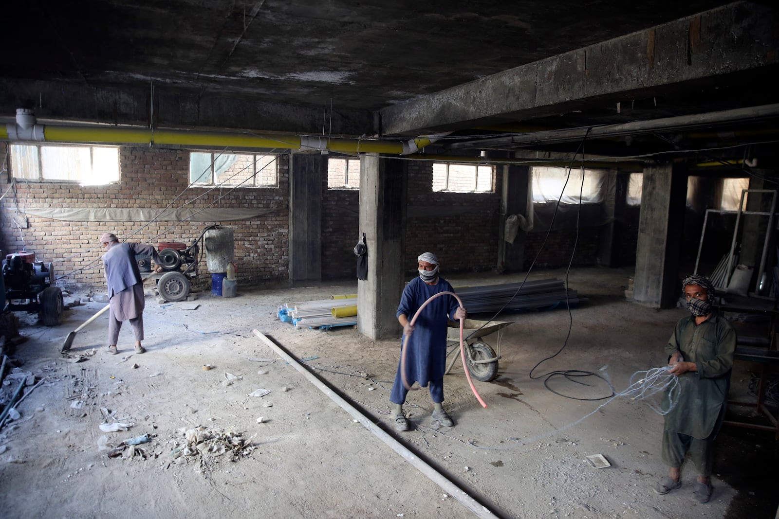 Laborers work to build a luxury market in the city of Kabul, Afghanistan, Sept. 23, 2024. (AP Photo/Siddiqullah Alizai)