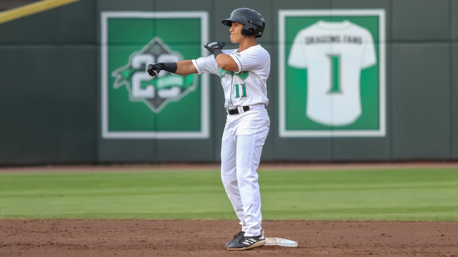 Dayton Dragons designated hitter Brian Rey celebrates after hitting a two-RBI double during their game against the Bowling Green Hot Rods on Tuesday night at Fifth Third Field. The Dragons won 6-1. CONTRIBUTED PHOTO BY MICHAEL COOPER