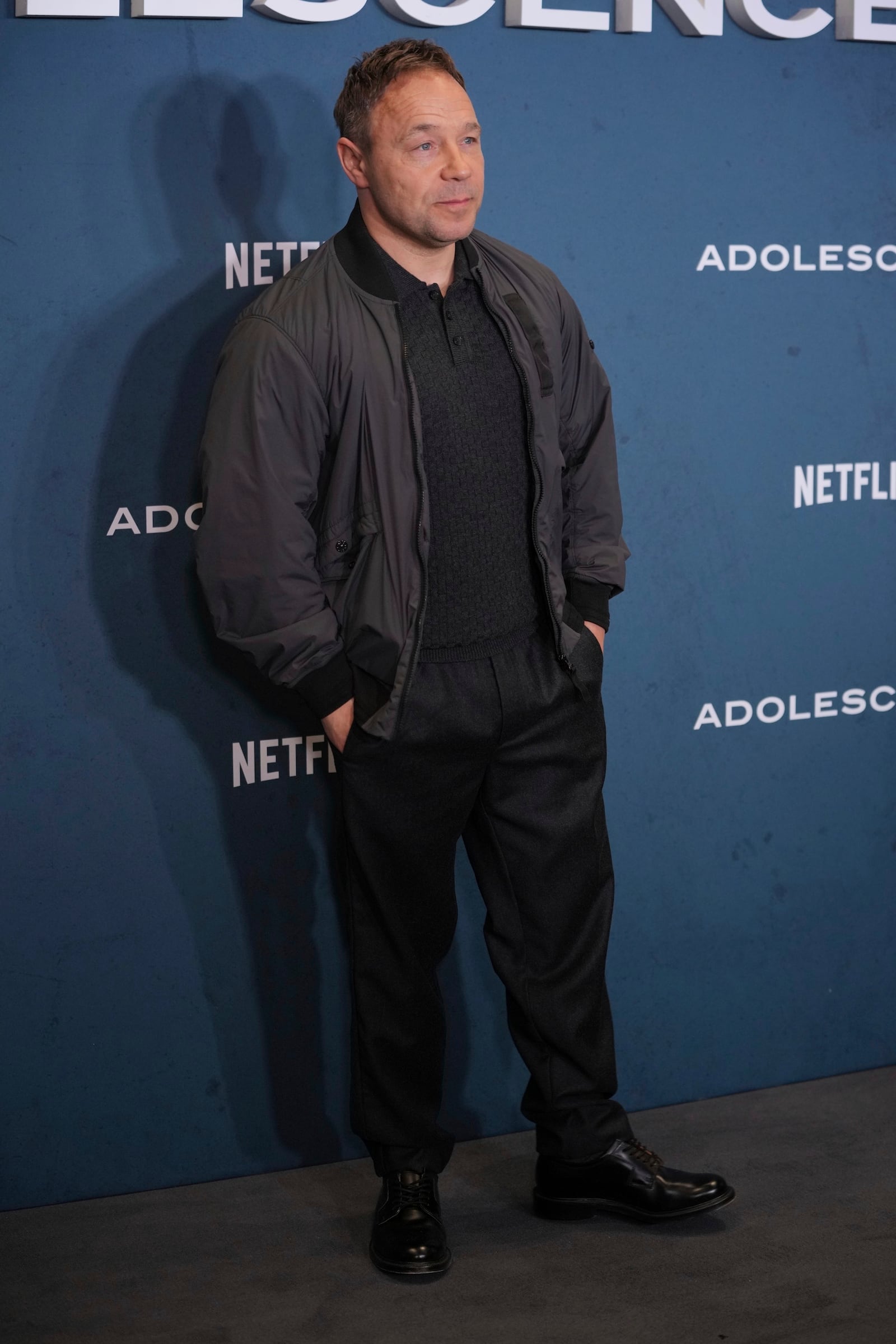 Stephen Graham poses for photographers upon arrival at the special screening for "Adolescence" in London, Wednesday, March 12, 2025. (AP Photo/Kin Cheung)