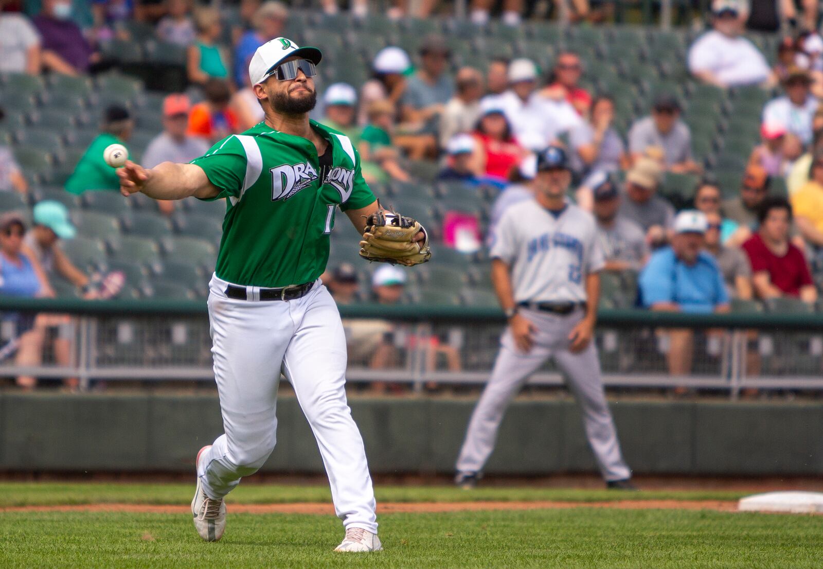 Dragons third baseman Juan Martinez fires to first base after fielding a bunt in the second inning of Sunday's game against Lake County at Day Air Ballpark. Jeff Gilbert/CONTRIBUTED