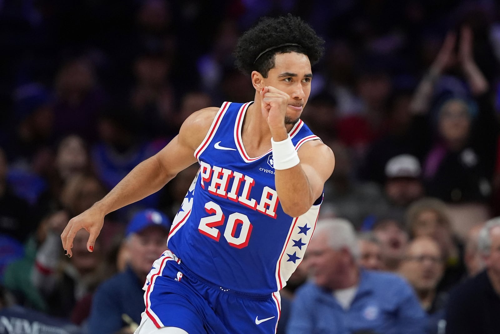 Philadelphia 76ers' Jared McCain reacts after scoring during the first half of an NBA basketball game against the Orlando Magic, Wednesday, Dec. 4, 2024, in Philadelphia. (AP Photo/Matt Slocum)