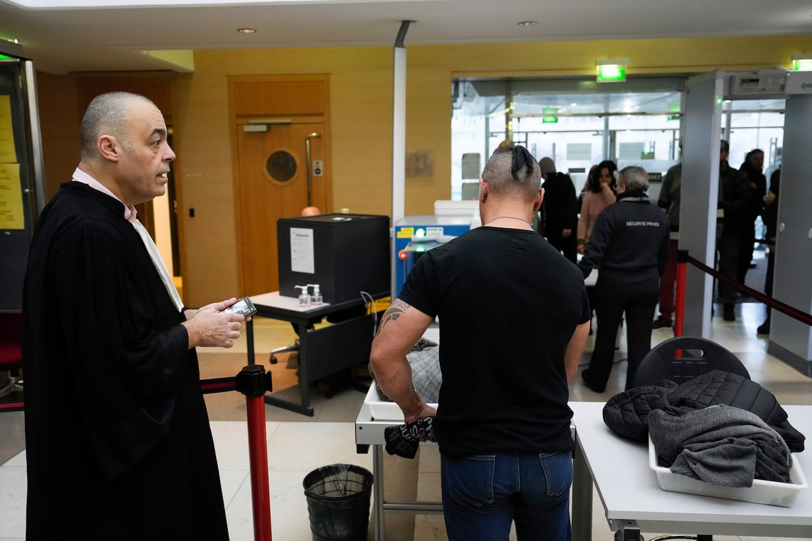 A defendant arrives in the Avignon courthouse, southern France, Thursday, Dec. 19, 2024. (AP Photo/Lewis Joly)