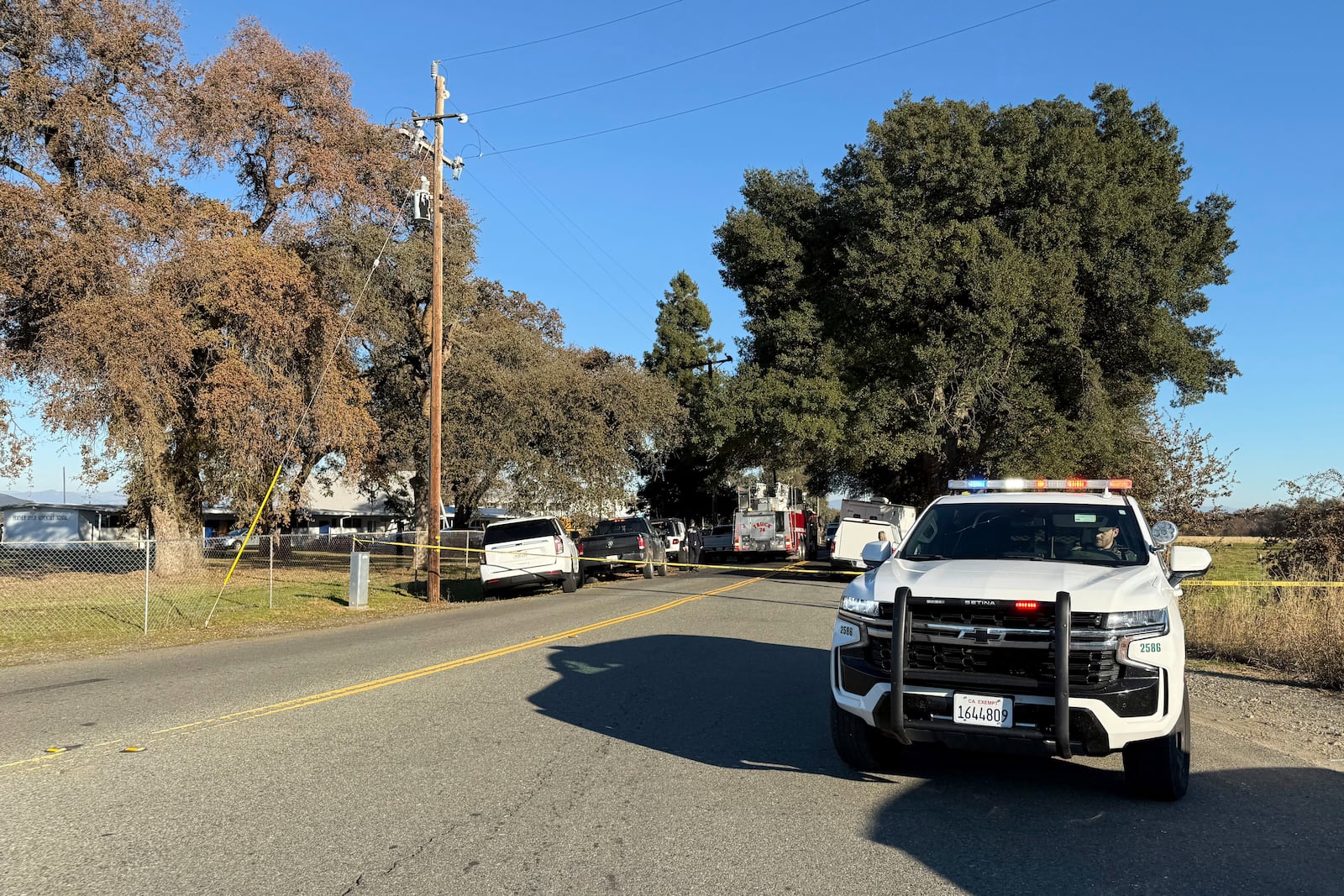 Police tape blocks a road outside the Feather River Adventist School after a shooting Wednesday, Dec. 4, 2024, in Oroville, Calif. (Michael Weber/The Chico Enterprise-Record via AP)