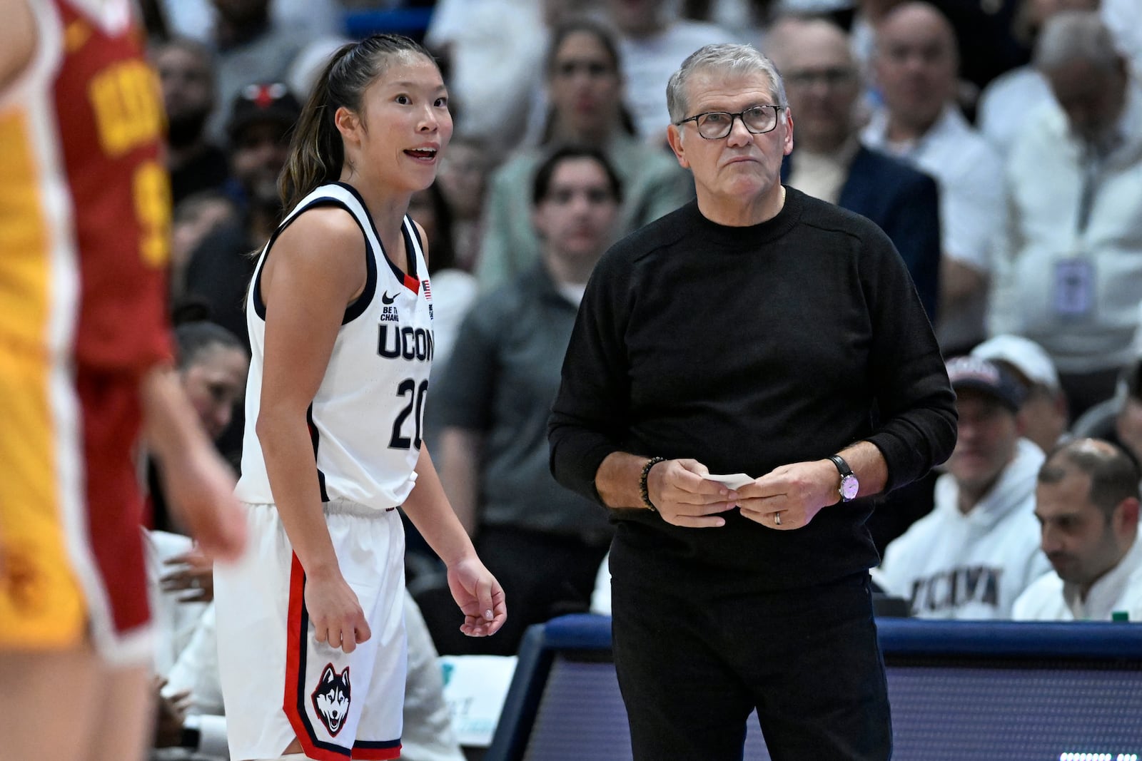 UConn guard Kaitlyn Chen, left, talks with UConn head coach Geno Auriemma, right, in the second half of an NCAA college basketball game against Southern California, Saturday, Dec. 21, 2024, in Hartford, Conn. (AP Photo/Jessica Hill)