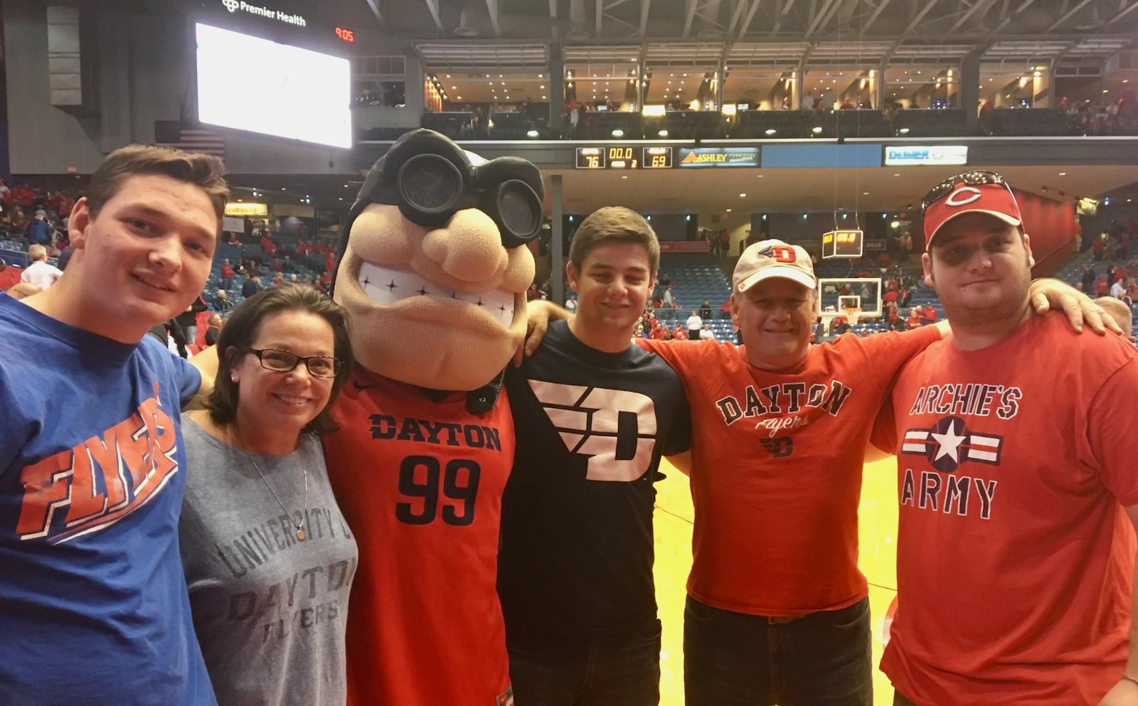 Tim Hanson poses for a photo as Rudy with brother Nick, mom Sarah, brother Andy, dad Steve and brother Matt at UD Arena. Contributed photo