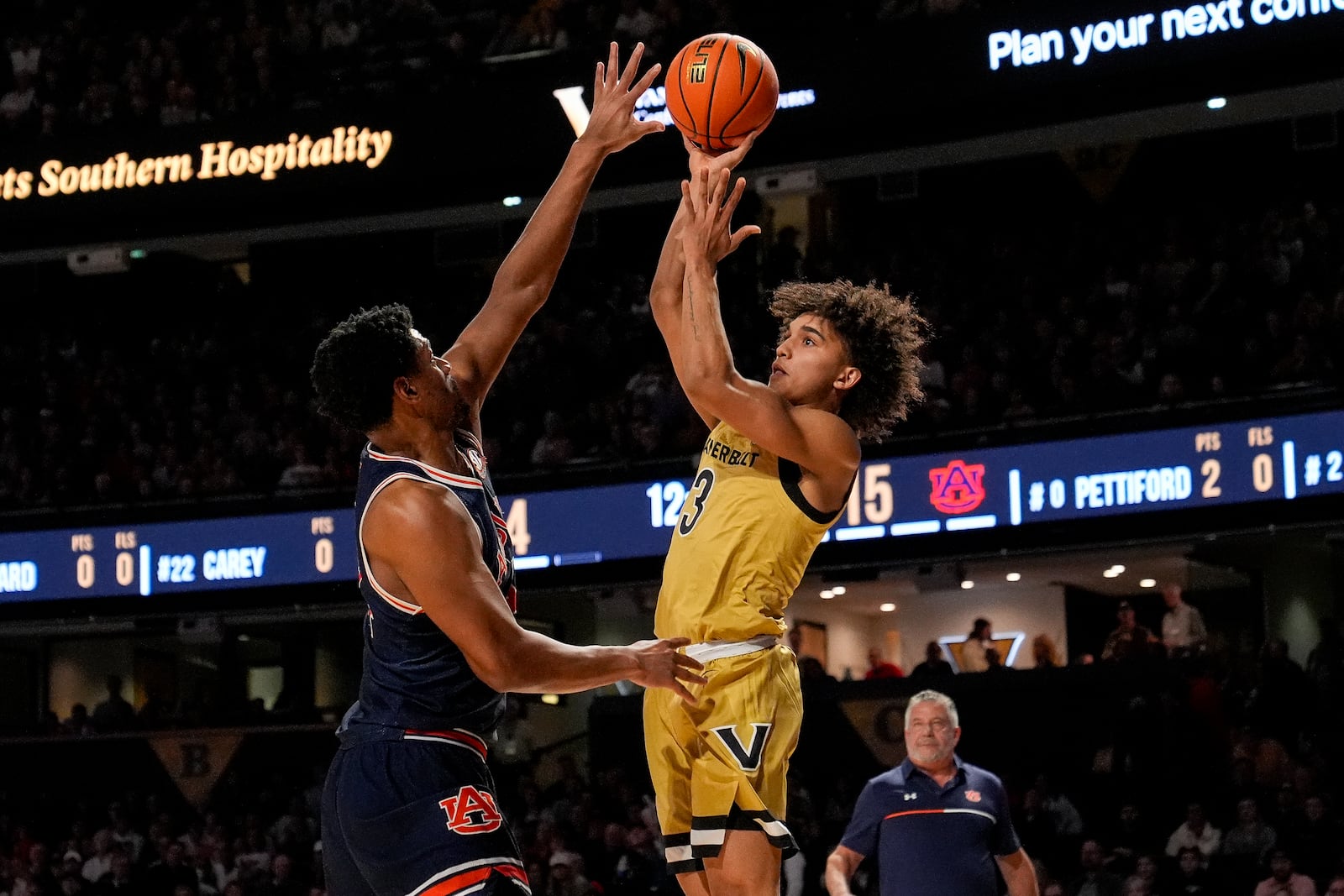 Vanderbilt guard Tyler Tanner (3) shoots the ball over Auburn center Dylan Cardwell, left, during the first half of an NCAA college basketball game Tuesday, Feb. 11, 2025, in Nashville, Tenn. (AP Photo/George Walker IV)