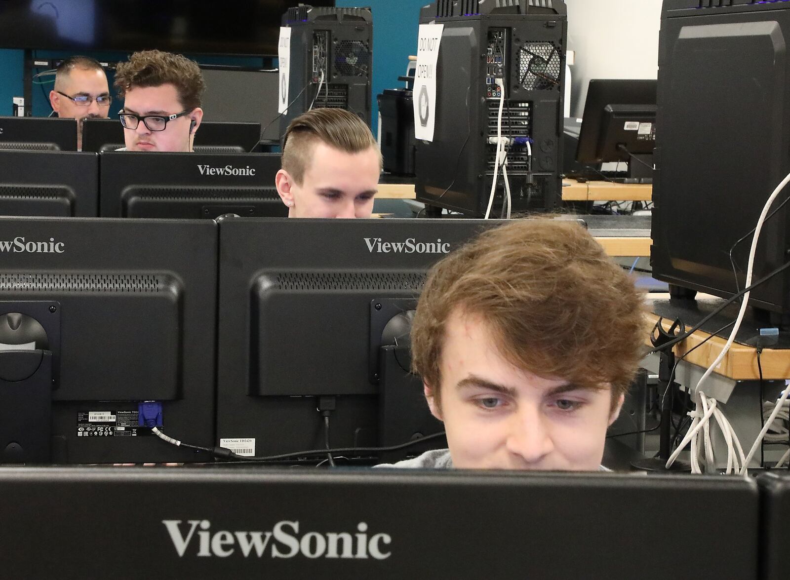 People work on computers in a cyber security class room at Clark State Community College Monday, June 18, 2018. Bill Lackey/Staff