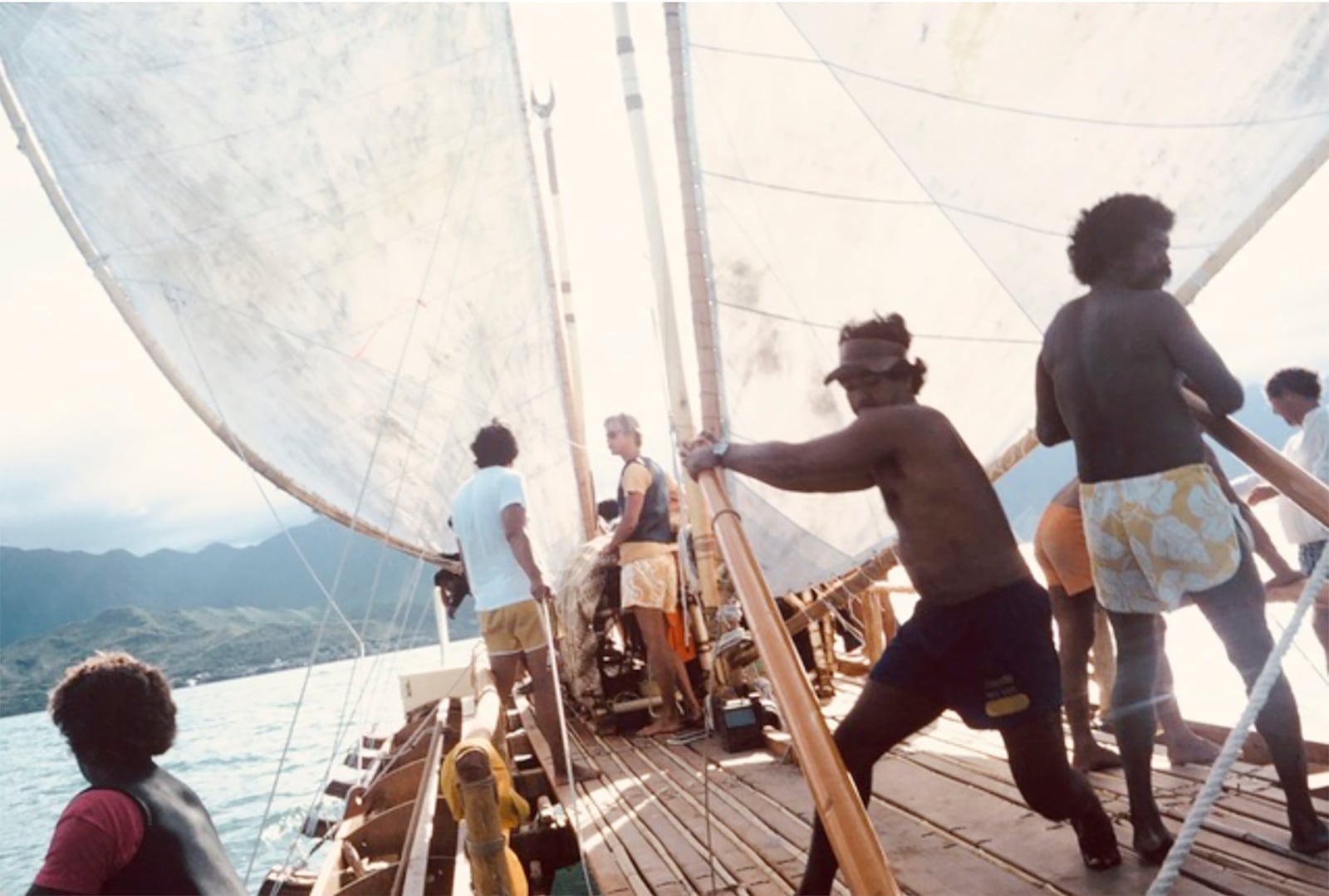 This April 1975 photo shows crew members training on the Hokulea canoe in waters off Kualoa on Oahu, Hawaii. (James Kimo Hugho via AP)