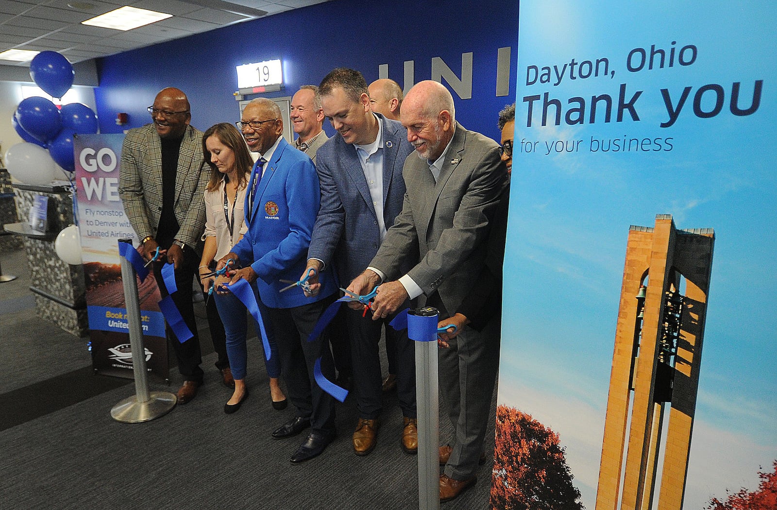 Dayton Mayor Jeffrey Mims, center, joins other local officials for a ribbon-cutting ceremony celebrating the Dayton International Airport's new United Airlines nonstop route from Dayton to Denver on Friday, Sept 29, 2023. MARSHALL GORBY\STAFF