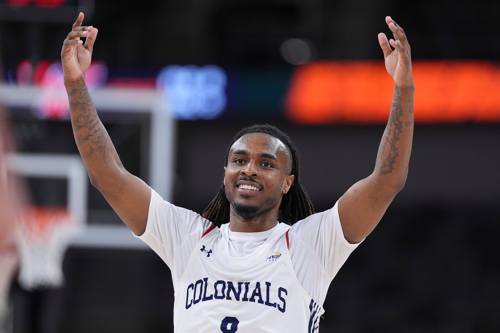 Robert Morris guard Kam Woods (8) celebrates in the second half of an NCAA college basketball game in the championship of the Horizon League tournament against Youngstown State in Indianapolis, Tuesday, March 11, 2025. (AP Photo/Michael Conroy)