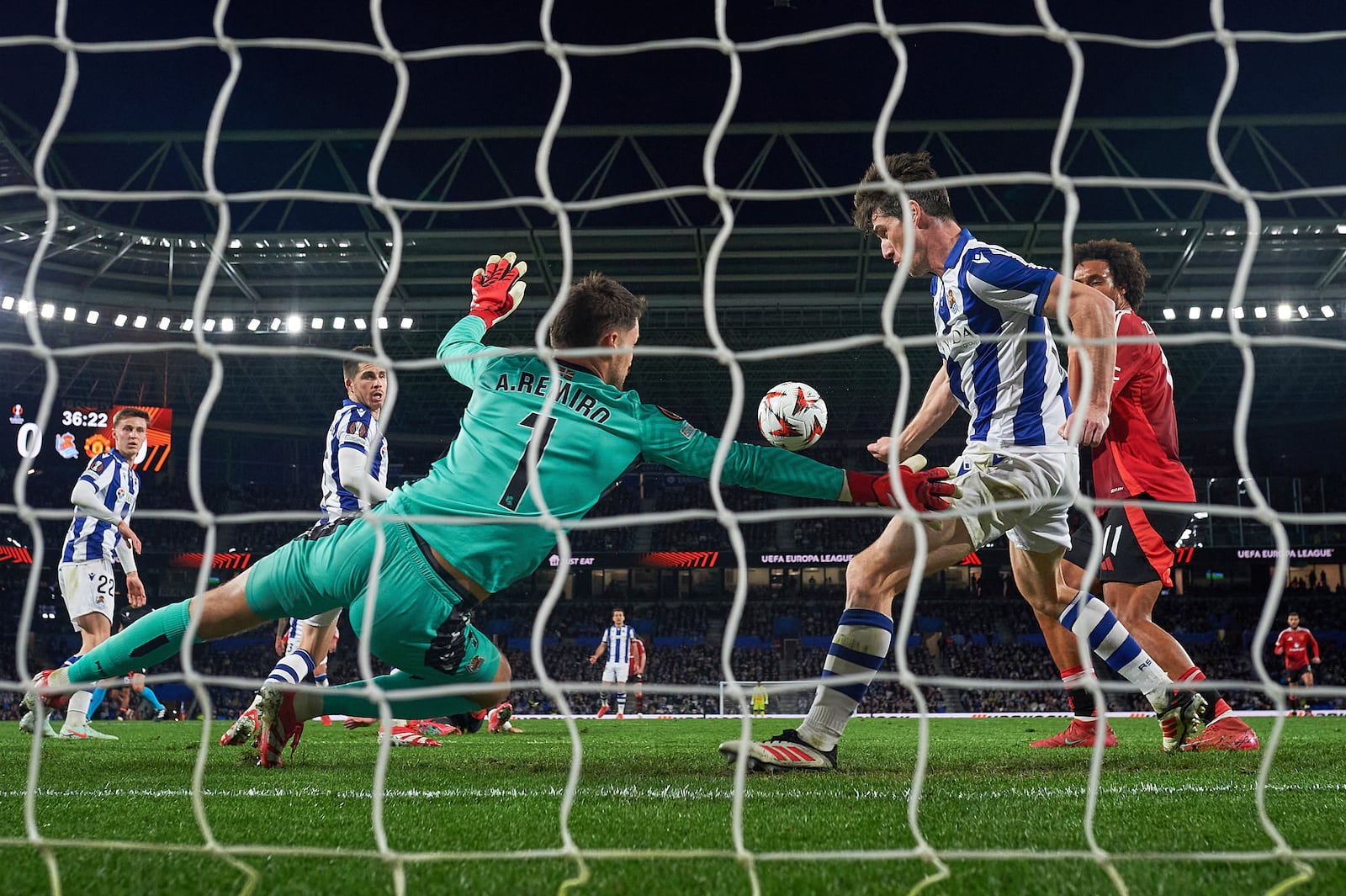 Real Sociedad's goalkeeper Alex Remiro makes a save during the Europa League round of 16 first leg soccer match between Real Sociedad and Manchester United at the Reale Arena in San Sebastian, Spain, Thursday, March 6, 2025. (AP Photo/Miguel Oses)