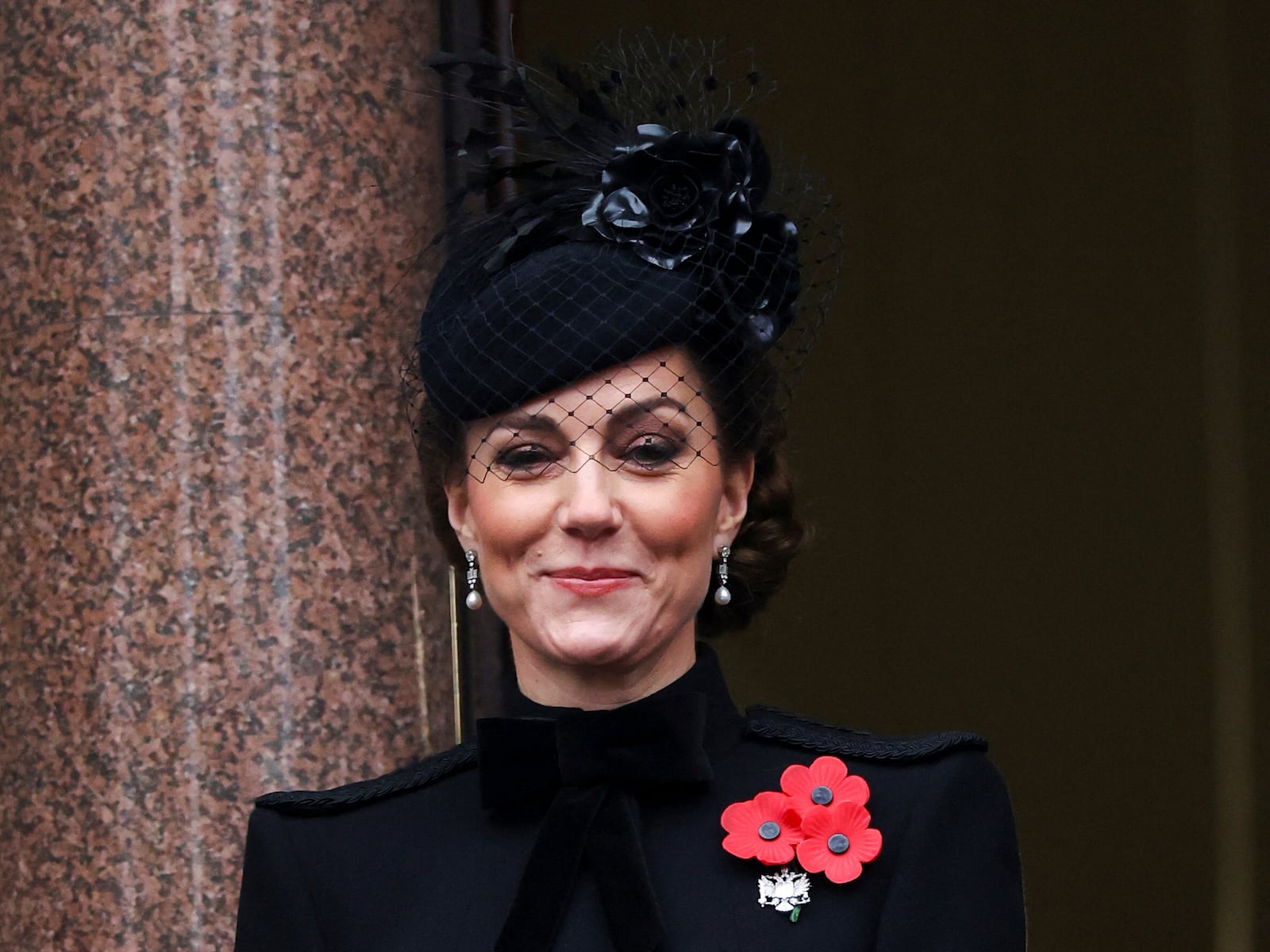 Britain's Kate, Princess of Wales, stands on a balcony during the National Service of Remembrance at The Cenotaph in London, England, Sunday, Nov. 10, 2024. (Toby Melville/Pool Photo via AP)