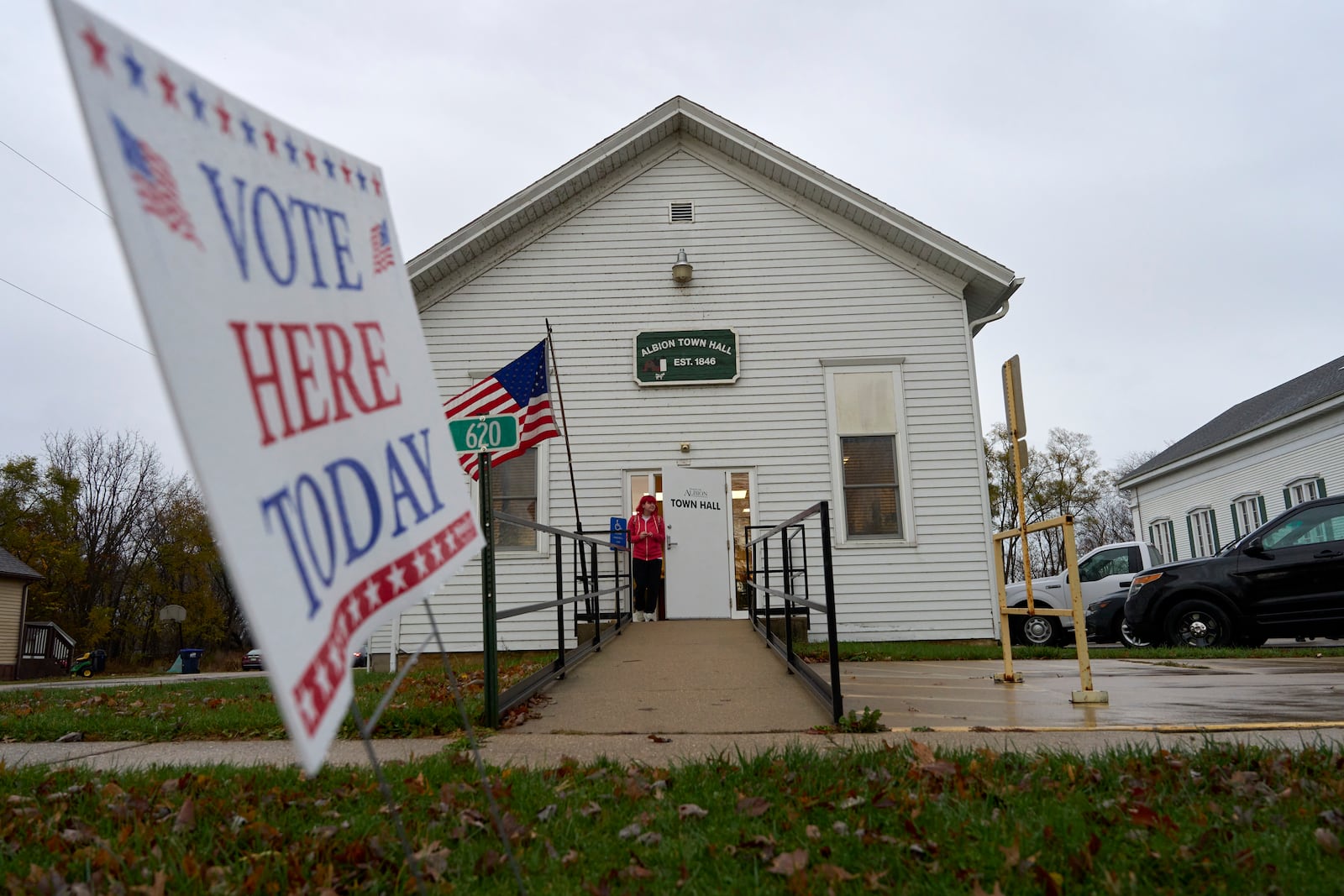 A voter leaves Albion Town hall after casting their ballot on Election Day, Tuesday, Nov. 5, 2024, in Albion, Wis. (AP Photo/Kayla Wolf)