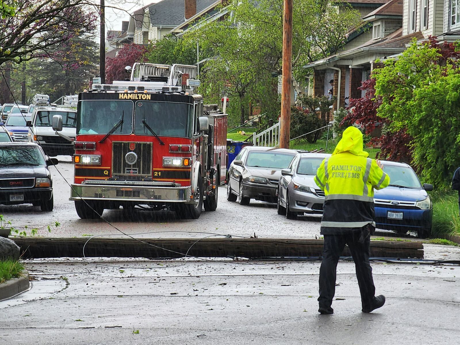 Officials work to restore power lines downed around the City of Hamilton after a storm on Tues., May 3, 2022. NICK GRAHAM/STAFF