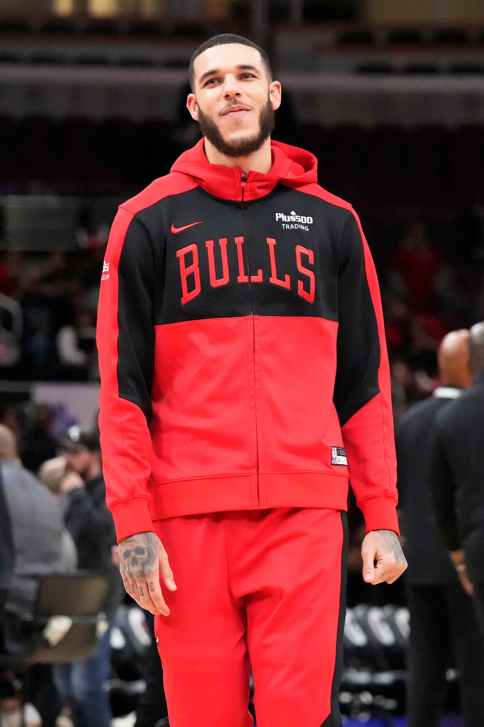 Chicago Bulls guard Lonzo Ball walks on the court as he warms up before an NBA preseason basketball game against the Minnesota Timberwolves in Chicago, Wednesday, Oct. 16, 2024. (AP Photo/Nam Y. Huh)