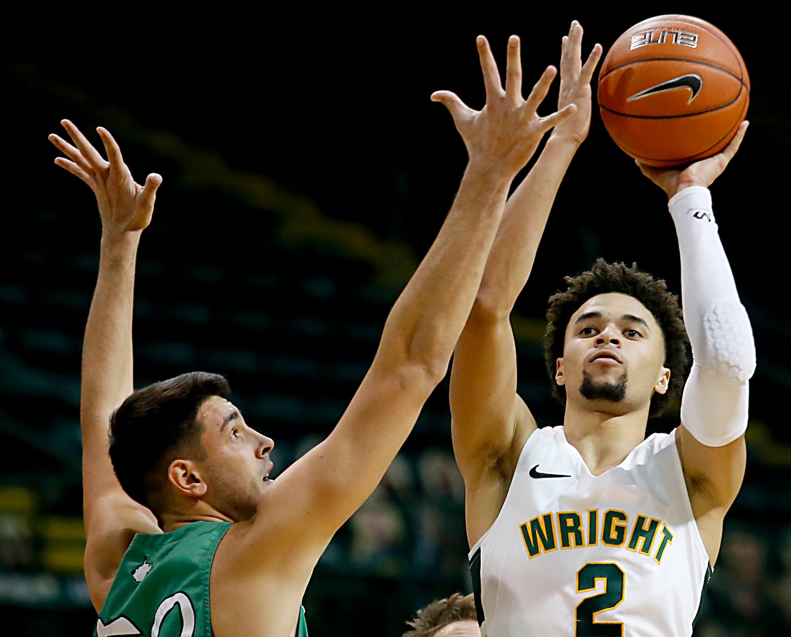 Wright State guard Tanner Holden shoots over Marshall center Goran Miladinovic during a mens basketball game at the Nutter Center in Fairborn Thursday, Dec. 3, 2020. (E.L. Hubbard for the Dayton Daily News)